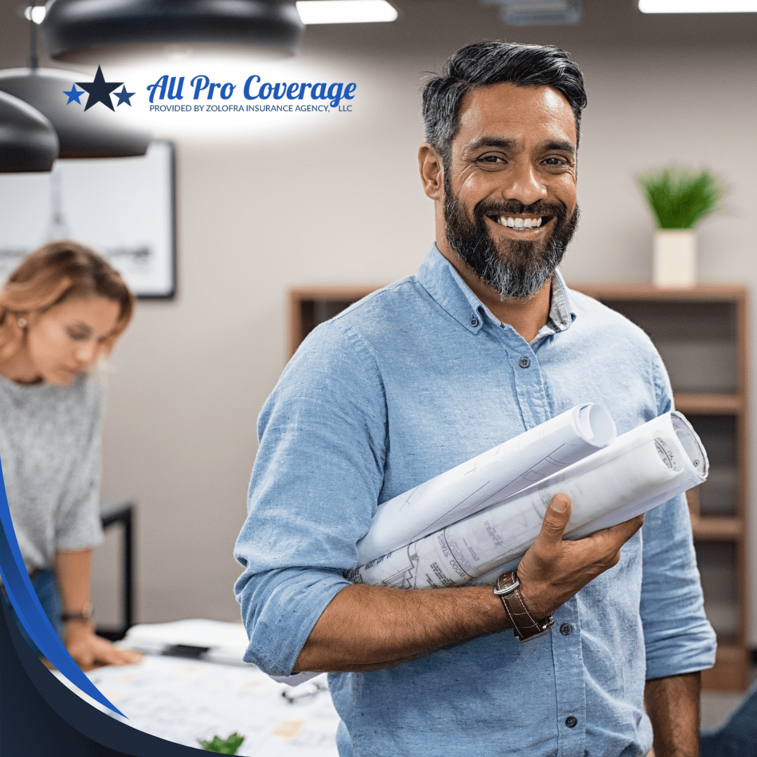 A smiling architect holding blueprints in a professional office setting